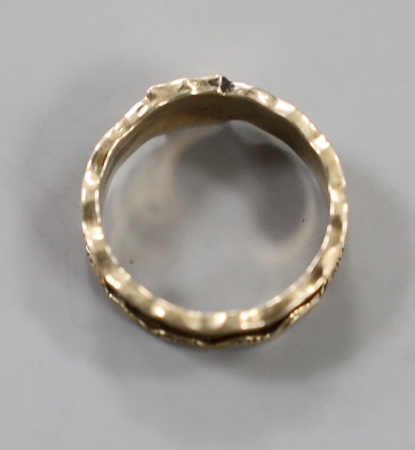 A 19th century yellow metal and plaited hair set band, the ring head with engraved monogram, size M/N, gross weight 1.8 grams.